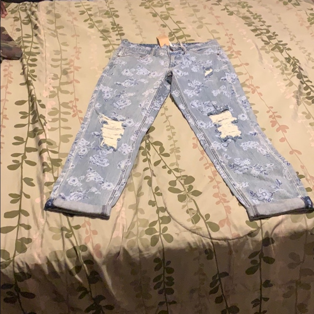 Blue destressed at knee with blue flowers denim